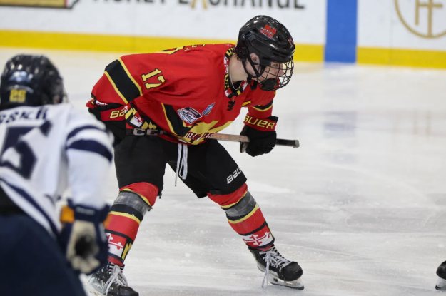 Coach Brayden, owner of Mindset Hockey, in a Team Maryland number 17 jersey lined up for a faceoff